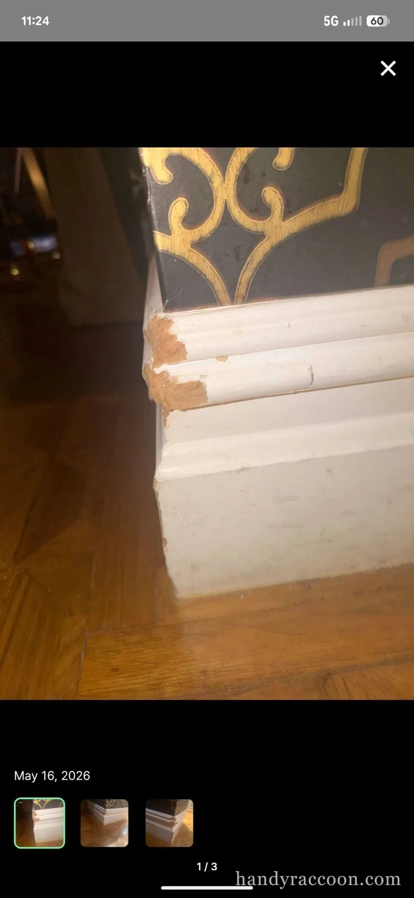 White wall with a smoothed, primed patch above the baseboard where a stain was repaired.